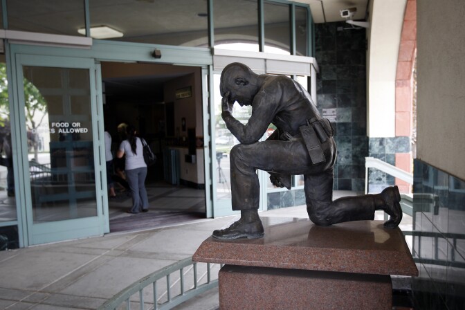 SAN BERNARDINO, CA - JULY 12:  A memorial to fallen police officers stands at the entrance to the City of San Bernardino Police Department on July 12, 2012 in San Bernardino, California. The San Bernardino City Council voted this week to file for Chapter 9 bankruptcy protection, making San Bernardino the second largest municipality in the nation ever to file for bankruptcy and the third in California to opt for bankruptcy in the past two weeks. Stockton, California with a population of nearly 300,000, became the biggest when it filed for bankruptcy on July 3. The Sierra Nevada Mountains ski town of Mammoth Lakes, California also voted for bankruptcy July 3. The city is facing a $45.8 million budget shortfall and is in danger of not making payroll for the next three months. City officials are set to discuss the next steps in the bankruptcy process and may also declare a fiscal emergency at its meeting July 16.  (Photo by David McNew/Getty Images)