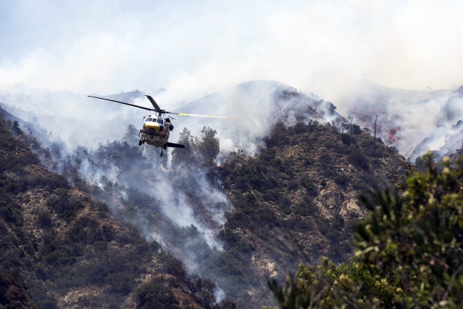 Aircraft make water drops over the San Gabriel Complex fire on Tuesday afternoon, June 21, 2016 in Bradbury near Spinks Canyon Road.