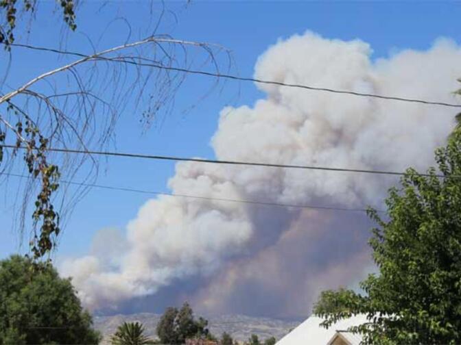 Smoke rises from the Silver Fire around 3 p.m. on Aug. 7, 2013, in a photo taken from nearby Hemet.
