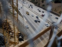 Motorists drive down the 405 Freeway where closures will occur from Interstate 10 to the 101 Freeway, northbound, and from the 101 Freeway to Getty Center Drive, southbound, during the demolition of the north side of the Mulholland Drive bridge Saturday to Sunday in Los Angeles, Calif., Tuesday, September 25, 2012. The demolition of the south side of the 608-foot bridge also caused freeway closures in July.