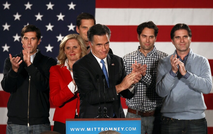 DES MOINES, IA - JANUARY 03:  Republican presidential candidate, former Massachusetts Gov. Mitt Romney, speaks as his wife Ann Romney and their sons (L-R) Josh, Matt, Craig and Tagg look on at the Hotel Fort Des Moines on the night of the Iowa Caucuses January 3, 2012 in Des Moines, Iowa. According to early results former Romney is expected to finish first or second in today's Iowa GOP caucus after a tight race with former U.S. Sen. Rick Santorum and U.S. Rep. Ron Paul (R-TX).  (Photo by Win McNamee/Getty Images)
