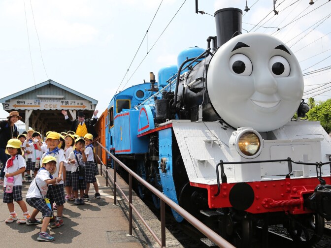 A life-sized Thomas the Tank Engine is surrounded by schoolchildren at Shinkanaya station along Japan's Oigawa railway, in the city of Shimada, west of Tokyo.