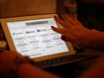 PASADENA, CA - NOVEMBER 19:  A healthcare reform specialist helps people select insurance plans at the free Affordable Care Act (ACA) Enrollment Fair at Pasadena City College on November 19, 2013 in Pasadena, California. The event, sponsored by the Chamber of Commerce and the Los Angeles Association of Health Underwriters, offers one-on-one sessions with insurance experts certified by Covered California to help people enroll for healthcare coverage under the ACA.  (Photo by David McNew/Getty Images)