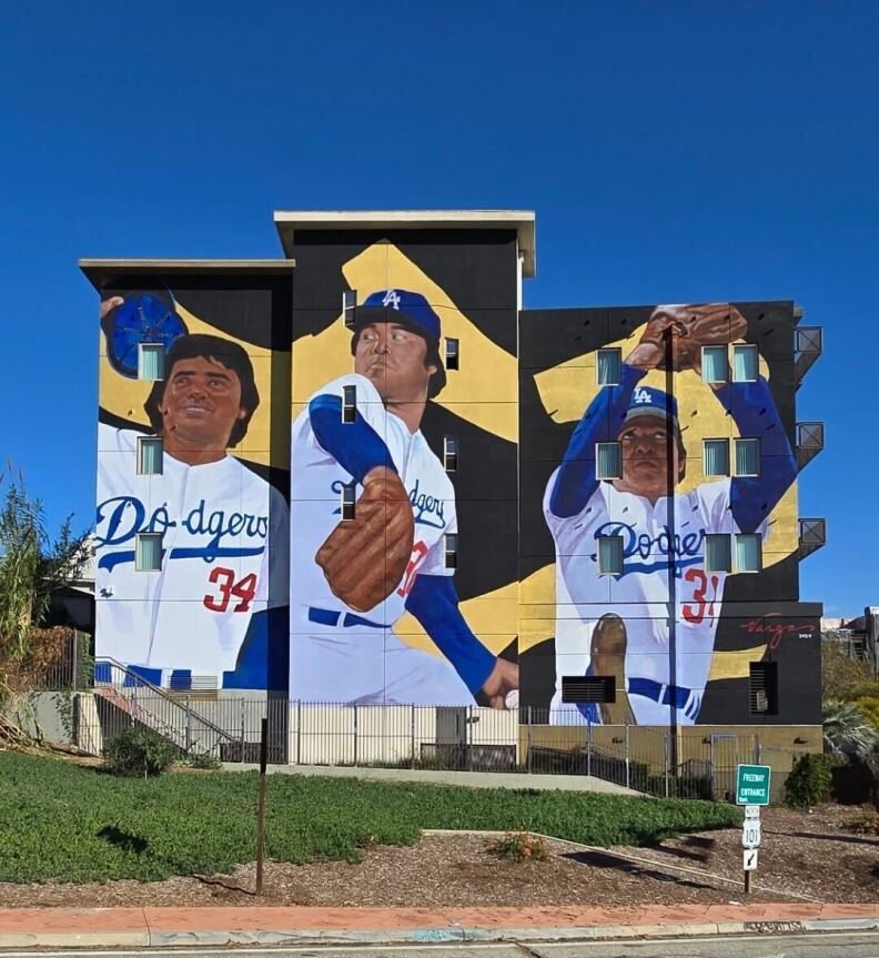 Three walls on an apartment building depict Fernando Valenzuela in an L.A. Dodgers uniform.