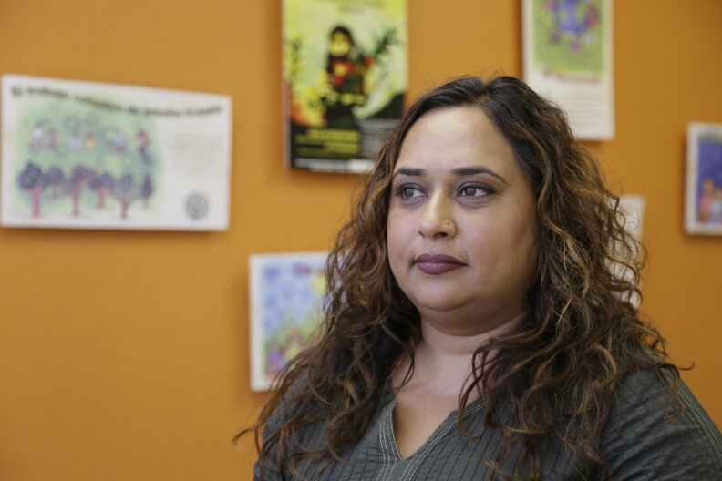 In this photo taken Friday, Sept. 2, 2016, Rajasvini Bhansali, executive director of the International Development Exchange, also known as IDEX, poses at her office in San Francisco. Black Lives Matter has quietly established a legal partnership with the California charity in a sign of the movement's growth and expanding ambition. The Associated Press has learned that IDEX is managing the group’s financial affairs, allowing Black Lives Matter to focus on its mission, including building local chapters and experimenting with its organizational structure. (AP Photo/Eric Risberg)