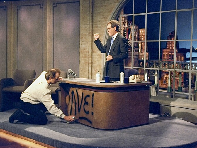 Bill Murray spray paints Dave's desk on the first taping of "The Late Show with David Letterman," Aug. 30, 1993.