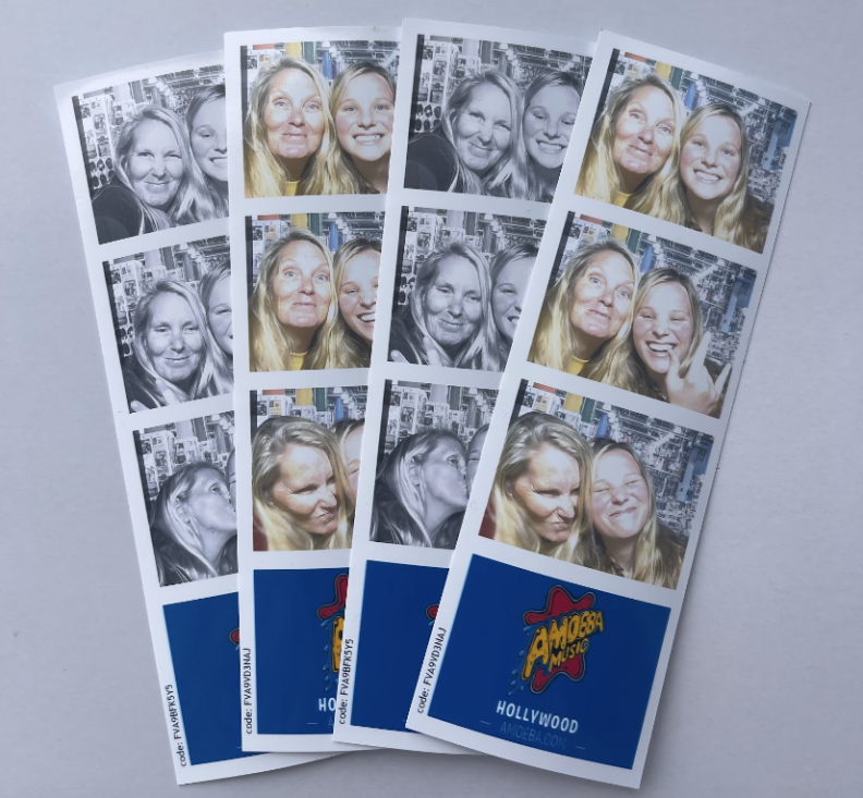 Four photo strips with the Amoeba Music logo overlap each other. Each photo strip features two women with what appears to be long blond hair and light skin tone. They both make a variety of faces in the different photos which are sepia and full color.