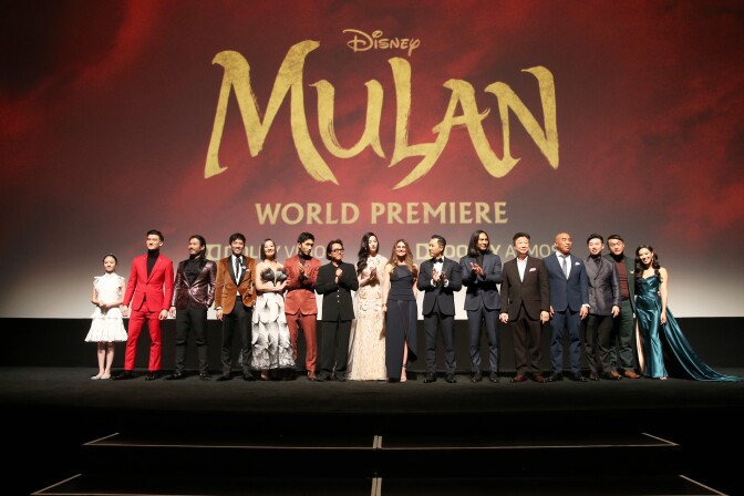 HOLLYWOOD, CALIFORNIA - MARCH 09: (L-R) Crystal Rao, Chen Tang, Nelson Lee, Jimmy Wong, Rosalind Chao, Yoson An, Jet Li, Yifei Liu, Director Niki Caro, Donnie Yen, Jason Scott Lee, Tzi Ma, Ron Yuan, Jun Yu, Doua Moua, and Xana Tang speak onstage during the World Premiere of Disney's 'MULAN' at the Dolby Theatre on March 09, 2020 in Hollywood, California. (Photo by Jesse Grant/Getty Images for Disney)