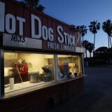 SANTA MONICA, CALIFORNIA  - MARCH 17: A worker cleans at a carryout hot dog stand on Santa Monica beach on March 17, 2020 in Santa Monica, California. Carryout restaurants are currently allowed to remain open in Los Angeles County. COVID-19 has claimed 13 lives in California so far with at least 470 people in the state testing positive for the coronavirus. Many more carry the coronavirus but have not been tested, according to officials. (Photo by Mario Tama/Getty Images)
