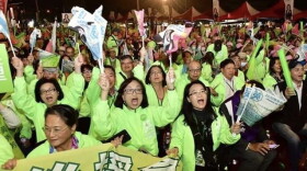 Southern Californian Taiwanese, including those pictured in green jackets, have returned to the island to vote in the contest for president. 