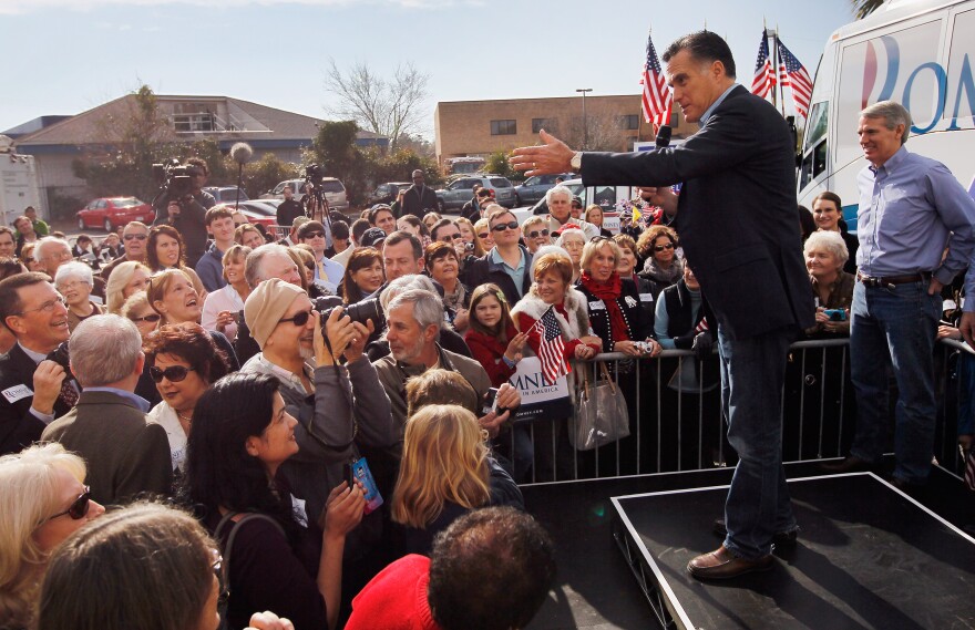 CHARLESTON, SC - JANUARY 19:  Republican presidential candidate, former Massachusetts Gov. Mitt Romney speaks to supporters as he visits a campaign headquarters on January 19, 2012 in Charleston, South Carolina. Today, one of Romney's opponents in the primary Texas Gov. Rick Perry dropped his bid for the Republican presidential nomination and endorsed competitor former Speaker of the House Newt Gingrich.  (Photo by Joe Raedle/Getty Images)