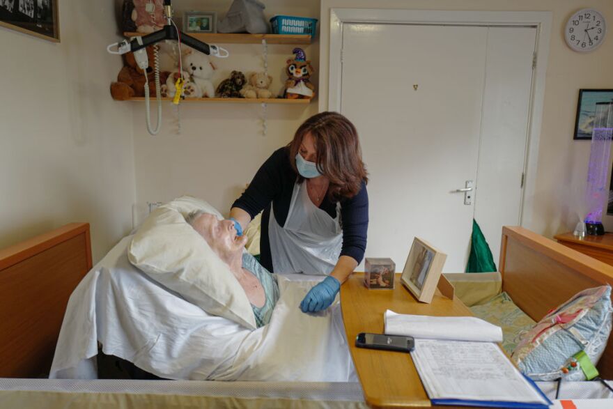FALMOUTH, ENGLAND - NOVEMBER 25: Della Lilley visits and holds her mother, 89-year old Betty Whiteman, for the first time in two months after successfully passing a rapid Covid-19 test at the King Charles Court Care Home, on November 25, 2020 in Falmouth, England. The home is one of 20 across Cornwall, Hampshire and Devon that are participating in a pilot programme using the Innova SARS-CoV-2 Antigen Rapid Qualitative test to screen residents' family members and friends for Covid-19, to permit more meaningful visits. (Photo by Hugh Hastings/Getty Images)