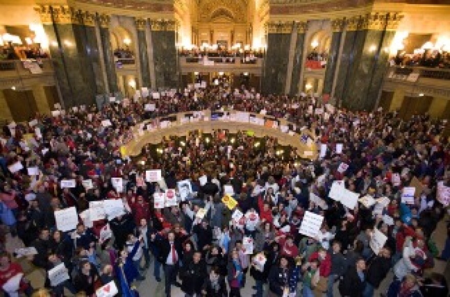 Protesters fill the Rotunda at the State Capitol building in Madison, Wisconsin. 