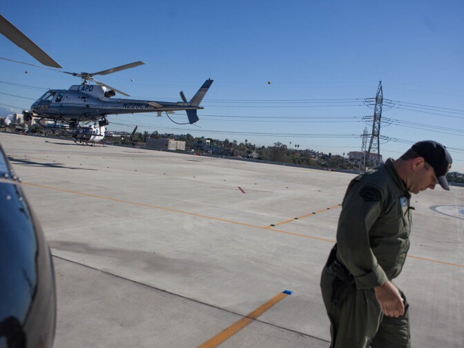 LAPD helicopter pilot Kevin Cook exits the helipad after a three-hour shift in the skies above Los Angeles.
