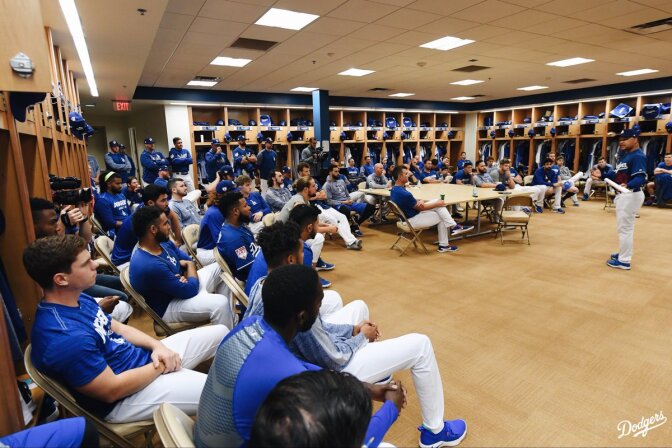 Dodgers manager Dave Roberts, speaks to players on the Dodgers in their locker room during spring training
