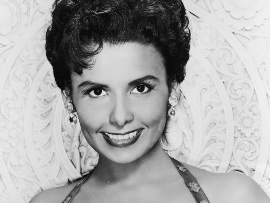 Lena Horne (photographed in the 1950s) broke barriers for African-Americans in film and television, as well as on stage.