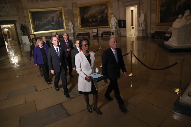 WASHINGTON, DC - JANUARY 15: Articles of Impeachment against U.S. President Donald Trump are formally carried through the Rotunda of the U.S. Capitol by officials from the U.S. House of Representatives to the U.S. Senate on January 15, 2020 in Washington, DC. The impeachment trial in the Senate is expected to begin early next week. Carrying the articles of impeachment is Clerk of the House of Representatives Cheryl Johnson accompanied by House Sergeant of Arms Paul Irving and managers appointed by Speaker of the House Nancy Pelosi including Rep. Adam Schiff (D-CA), Rep. Jerry Nadler (D-NY), Rep. Zoe Lofgren (D-CA), Rep. Hakeem Jeffries (D-NY), Rep. Val Demings (D-FL), Rep. Jason Crow (D-CO) and Rep. Sylvia Garcia (D-TX). (Photo by Win McNamee/Getty Images)
