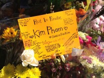 A makeshift memorial on Fourth Street and Broadway for Kim Pham.
