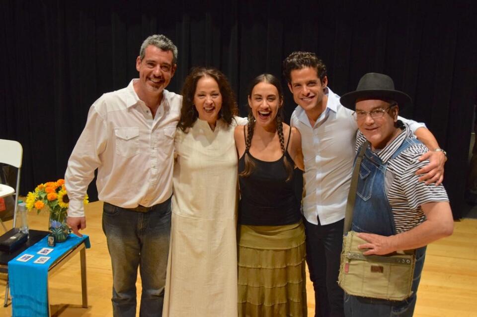 Playwright Oliver Mayer (L-R) and Perla Batalla stand with the cast of "The Blue House" after a reading.