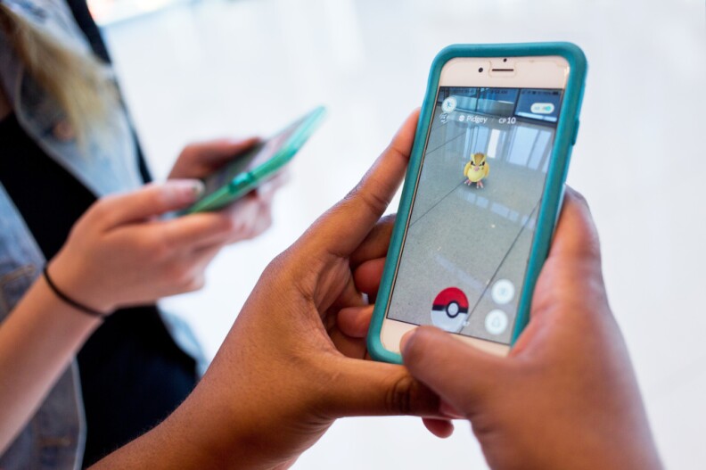 File: People playing Pokemon Go. 
