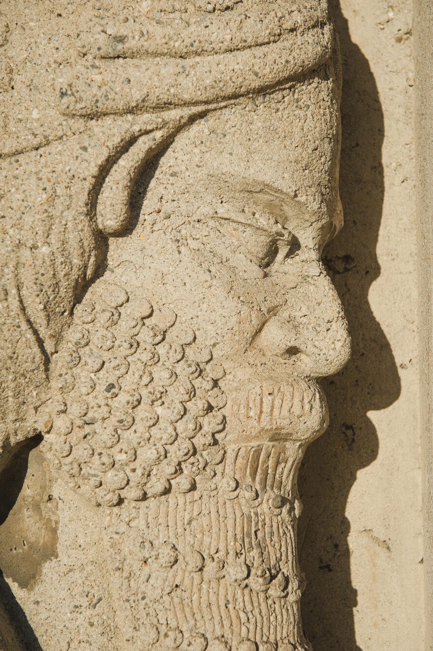 A concrete figure modeled on ancient carvings decorates the Citadel Outlets in Commerce, California.