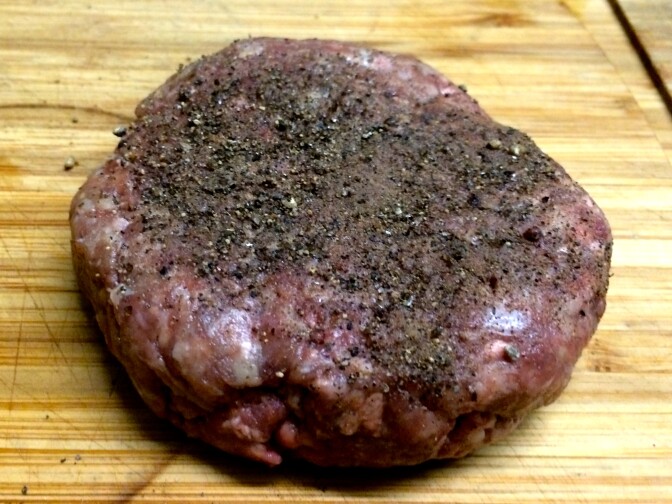 A grass fed beef patty from Northern California, made with different cuts and dry aged fat.