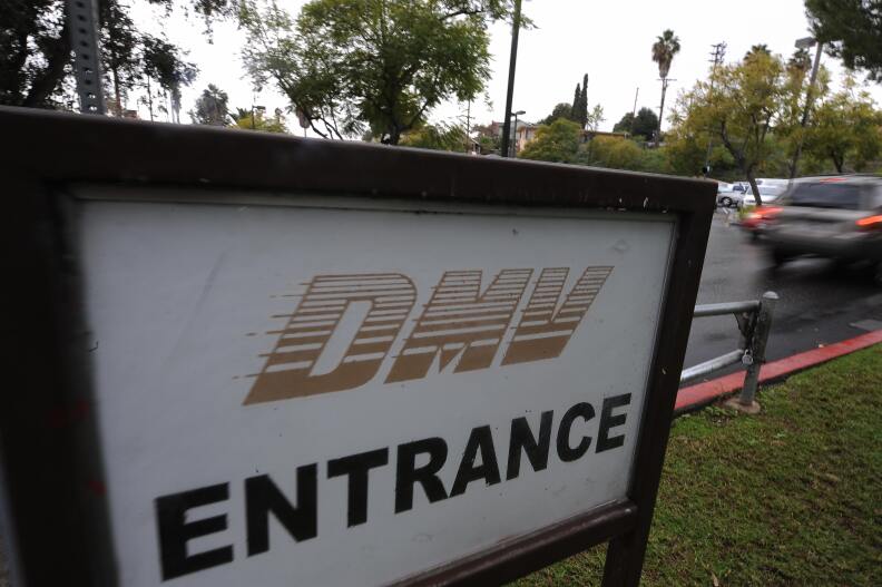 A car arrives at the State of California Department of Motor Vehicles (DMV) in Los Angeles, California on February 13, 2009.   The DMV, already infamous for long waiting times, is now further taxed as employees are off the job and the offices are closed two days a month as California government imposes its first-ever unpaid furlough to save money during the fiscal crisis.  The action is in connection with Schwarzenegger’s executive order that addresses the state’s 42 billion USD deficit and ongoing fiscal crisis.  Schwarzenegger has also threatened to lay off as many as 10,000 state employees if a new budget is not passed this week.  AFP PHOTO/ ROBYN BECK (Photo credit should read ROBYN BECK/AFP/Getty Images)