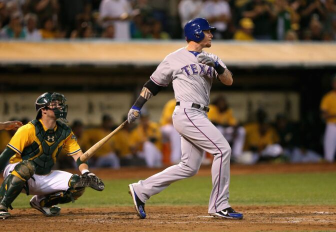 OAKLAND, CA - OCTOBER 02:  Josh Hamilton #32 of the Texas Rangers hits a double that scored Ian Kinsler #5 in the third inning of their game against the Oakland Athletics  at O.co Coliseum on October 2, 2012 in Oakland, California.  (Photo by Ezra Shaw/Getty Images)