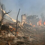 Fire burns close to homes off Malibu Canyon Road Oct. 21, 2007 in Malibu, California.