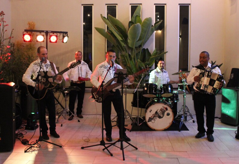 five person Sin Frontera band performing