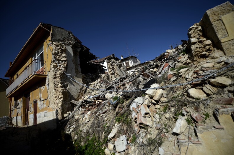 This picture shows damaged building following the 2009 earthquake on October 22, 2012 in the village of Onna. Six Italian scientists and a government official were found guilty the same day of multiple manslaughter for underestimating the risks of a killer earthquake in L'Aquila in 2009, and sentenced to six years in jail in a watershed ruling in a case that has provoked outrage in the international science community. 
