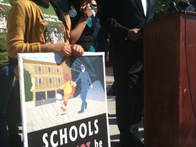 Hernan Vera, C.E.O. of Public Counsel, leads a news conference announcing the L.A.P.D. has relaxed enforcement of daytime curfew restrictions for students after complaints officers were indiscriminately enforcing the law.
