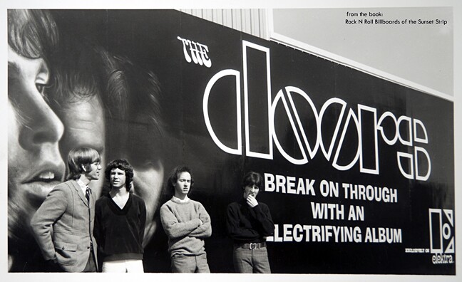 The Doors band members pose their billboard for thier debut record album at Foster and Kleiser studios in Los Angeles. 