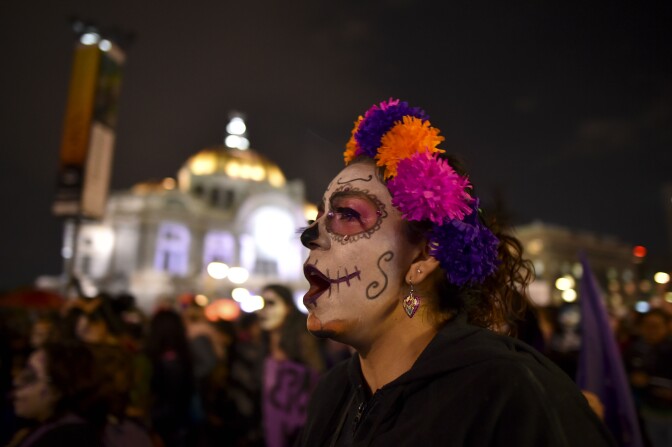 A woman shouts slogans during a protest against femicides in Mexico City on November 1, 2016.