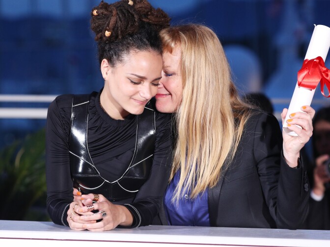 CANNES, FRANCE - MAY 22:  Director Andrea Arnold (R) celebrates with Sasha Lane after being awarded the Jury Prize for the film 'American Honey' during the Palme D'Or Winner Photocall during the 69th annual Cannes Film Festival at the Palais des Festivals on May 22, 2016 in Cannes, France.  (Photo by Andreas Rentz/Getty Images)