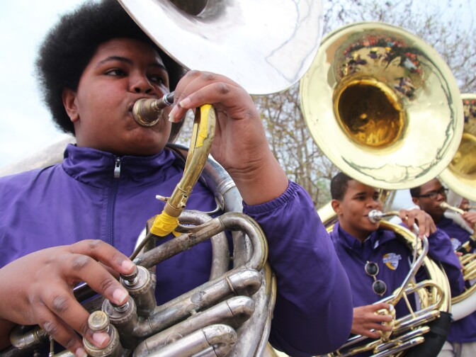 Nicholas Nooks (left) is known in the band room as "Big Nick." At nearly 300 pounds, he seemed like a good fit for football, but he gave up the sport in favor of playing sousaphone and tuba.