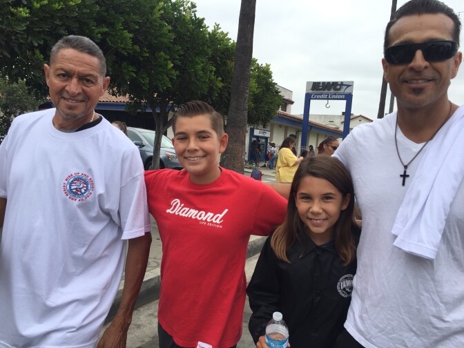 Longshoreman Bobby Carrillo with his son and grandchildren at the Labor Day parade in Wilmington.