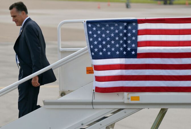 US Republican presidential candidate Mitt Romney disembarks from his campaign plane upon arriving in Tampa, Florida, on August 29, 2012.
