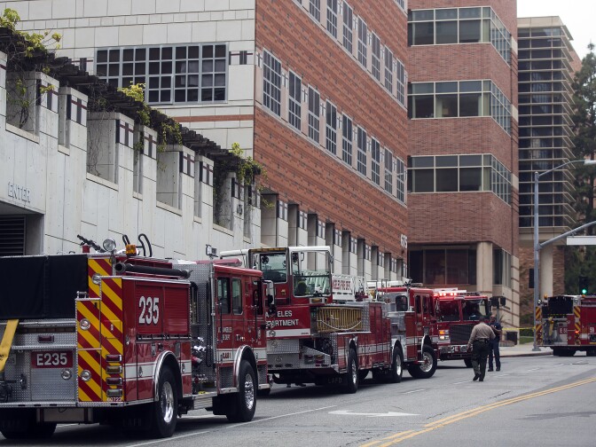 Fire trucks fill the Charles E. Young Drive South at Westwood Boulevard on Wednesday, June 1, 2016 following a murder-suicide on the University of California, Los Angeles campus.