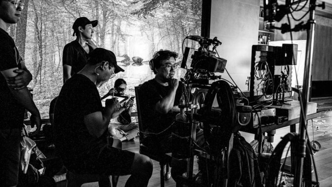 Director Bong Joon-ho (behind camera) on the set of "Parasite."