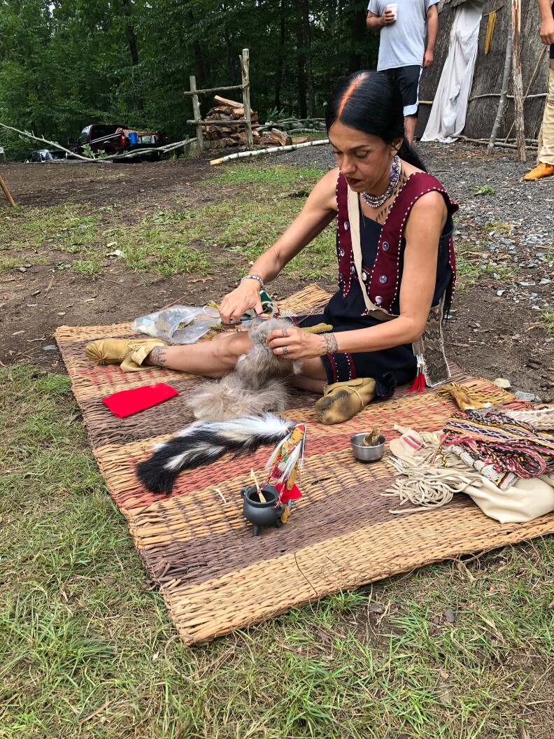 Mashpee Wampanoag Kerri Helme makes traditional children's dolls during the August Green Corn Festival at Mashantucket in southeastern Connecticut.