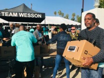 People waited in long lines to grab boxes of turkeys and thanksgiving fixings. (Emily Dugdale/KPCC) 