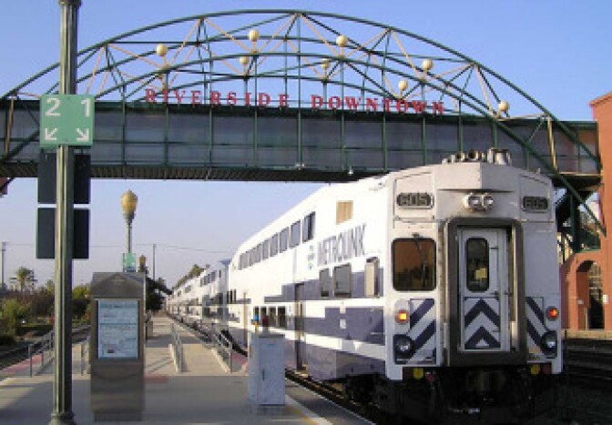 A Metrolink passenger train car arrives at the downtown Riverside station.