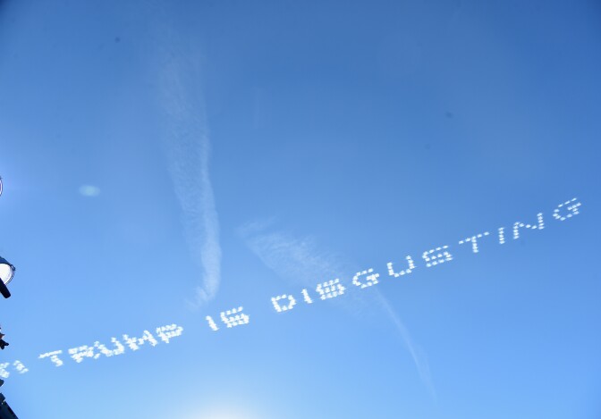 At the 127th Tournament of Roses Parade in Pasadena, Calif., sky-written messages included "America is Great! Trump is disgusting," "Iowans dump Trump" and "Putin eats Trump for dessert."