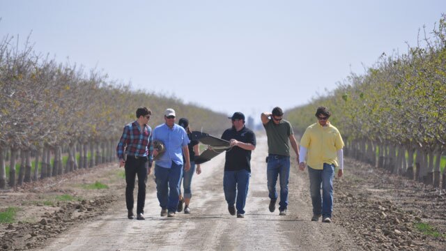 John Faus of HoneyComb demonstrates an agricultural drone in a pistachio orchard. 