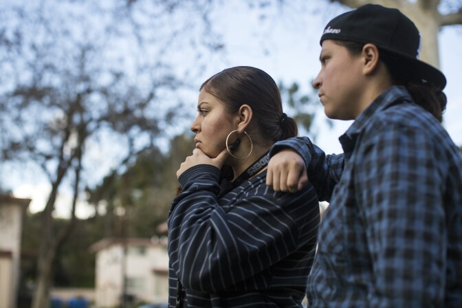 "We want them to see us as youth and not gang members" says Amanda Gutierrez, left, while looking at a mural memorializing a community member killed by police in the 1990s at Ramona Gardens in Boyle Heights on Friday, Jan. 13, 2017.