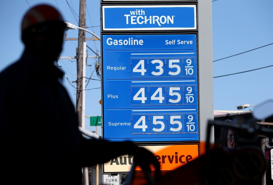 Gas prices are displayed as a motorcyclist pumps gas into his motorcycle at a Chevron gas station on March 1, 2013 in San Francisco, California.  The California Board of Equalization voted on Thursday to implement a statewide excise tax on gasoline starting July 1 that will increase the tax by 3.5 cents to 39.5 cents per gallon. 