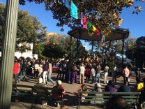 Crowds gather at Olvera Street, Los Angeles for the Virgen of Guadalupe celebration in December, 2015, near to where families of the missing in Mexico set up displays of photographs of their loved ones.
