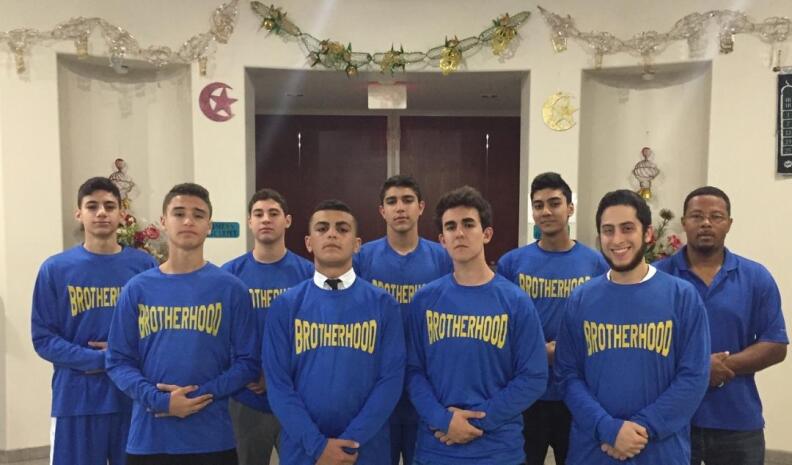 Team photo of the AAU basketball team, the Motor City Muslims. We talked to their coach, Clarence Archibald (far right) 