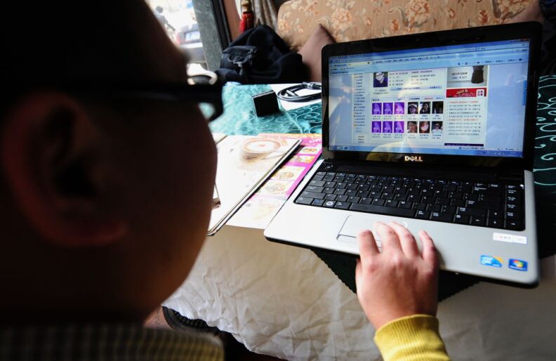 Beijing office worker Jiang Hui surfs the internet looking for love at a cafe in Beijing on February 5, 2010. By joing an online dating site, Jiang, who hasn't dated a girl since graduating from college four years ago, hopes this Valentine's Day - which falls on the same day as the first day of the Chinese new year this year- will be different as he began his cybersearch for a sweetheart three months ago, utilising an exploding industry as millions of young Chinese like him take advantage of technology and a newfound freedom to control their own love lives. 
